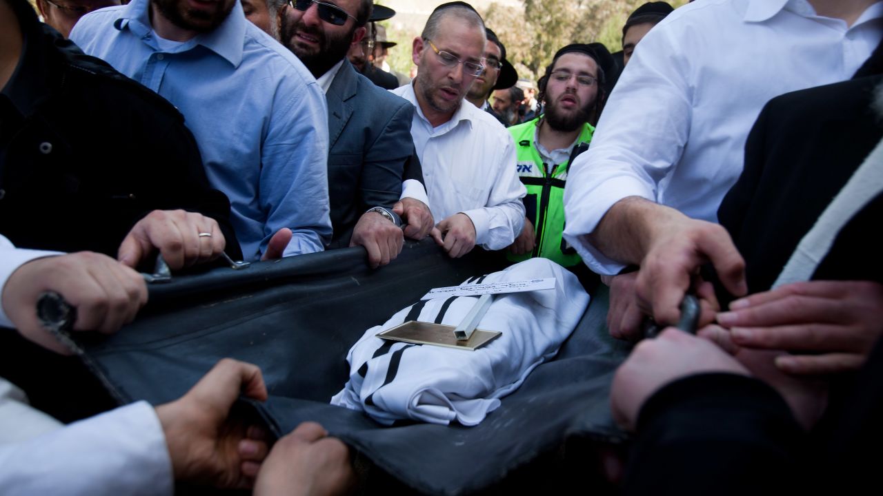  Relatives and other mourners in Jerusalem carry the body of one of the four victims of the Toulouse, France, school shooting.