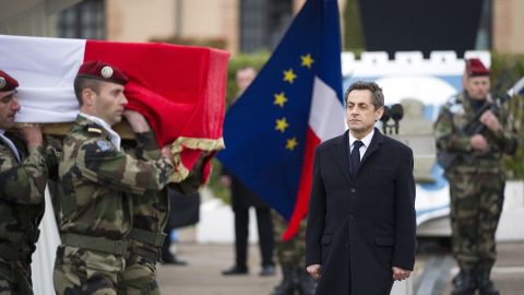 French President Nicolas Sarkozy watches March 21 as soldiers carry the coffin of a paratrooper killed by the Toulouse gunman. 