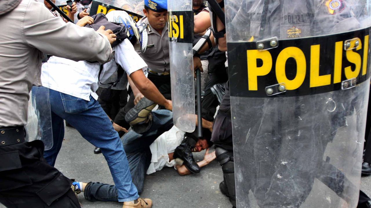 Police arrest a protestor during clashes at a demonstration against a rise in fuel prices earlier this week.