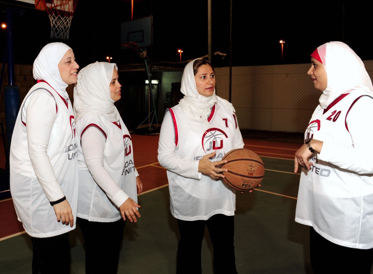 "We are trying to make it on a national level, integrate into public schools and then maybe compete on a regional level before we even think of the Olympics," says Lina Al-Maeena (center), captain of the Saudi women's basketball team.