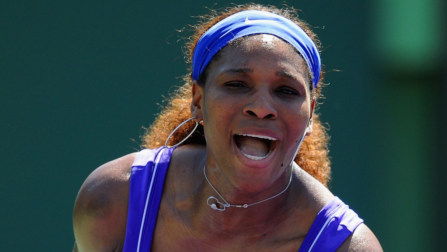 Serena Williams celebrates defeating Shuai Zhang in her first match since the Australian Open.