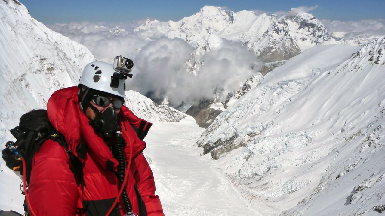 Dellis climbs Mt. Everest in May 2011. Through his charity, he climbs mountains to raise money for Alzheimer's disease research.