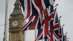 British Union Jack flags flutter in the wind next to Big Ben, in London, on April 28, 2011. 
