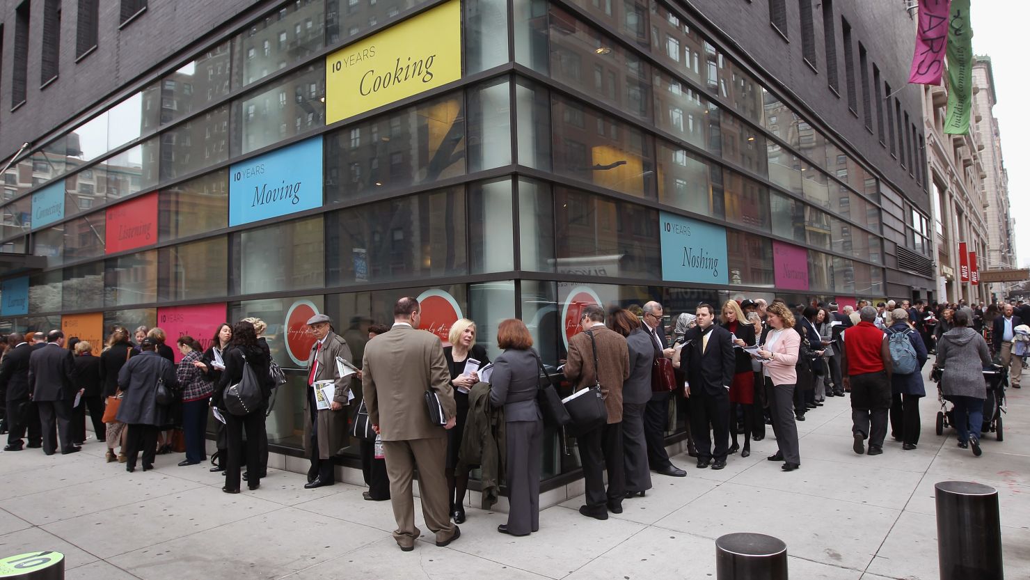 People stand in a line that stretched around the block to enter a job fair on March 21 in New York City.