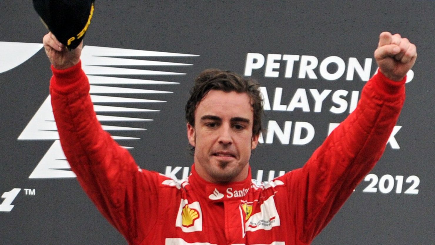 Spain's Fernando Alonso celebrates his victory in the Malaysian Grand Prix at Sepang.