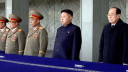 Kim Jong Un (3rd R) attends a memorial service on the 100th day since the death of the late leader Kim Jong Il on March 25.