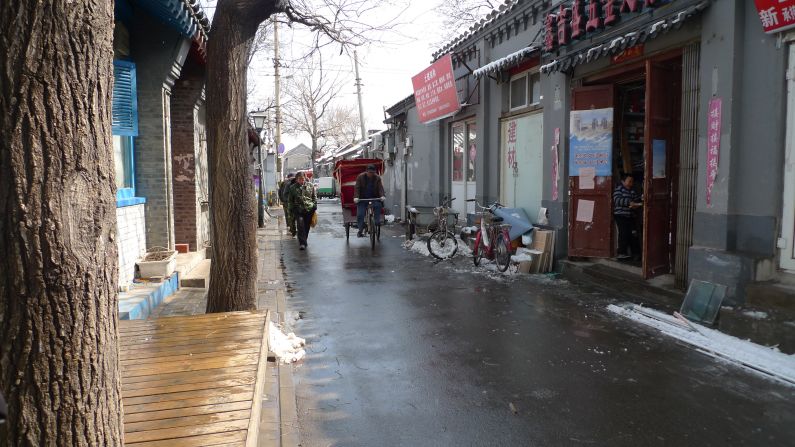But many places emblematic of old Beijing, including many hutong, Beijing's traditional courtyard housing, are threatened by modernity.  Pictured is a street view of Guowang Hutong, which is located near Beijing's historic Drum and Bell Towers. 