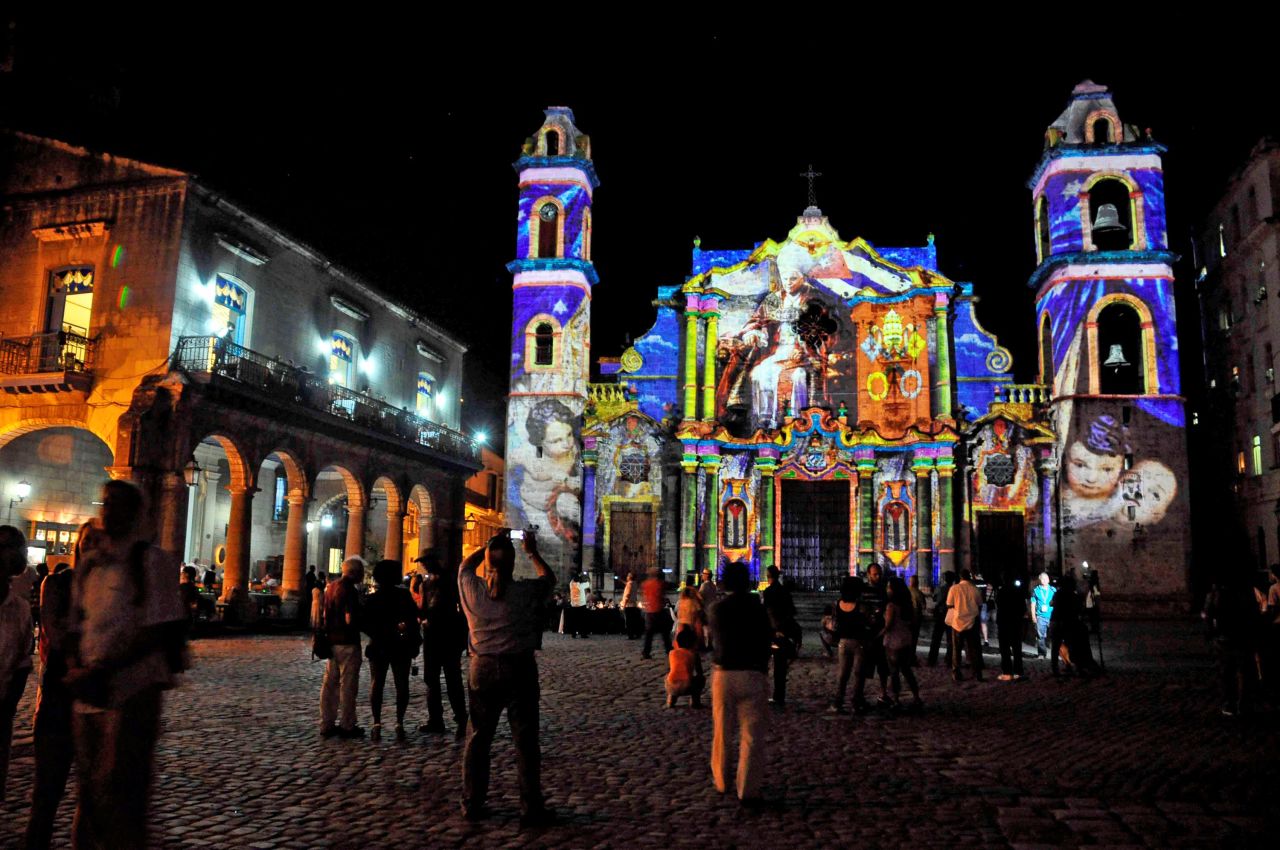 Cubans watch a projection with images of Pope Benedict XVI on the walls of Havana's Cathedral, on Sunday. 