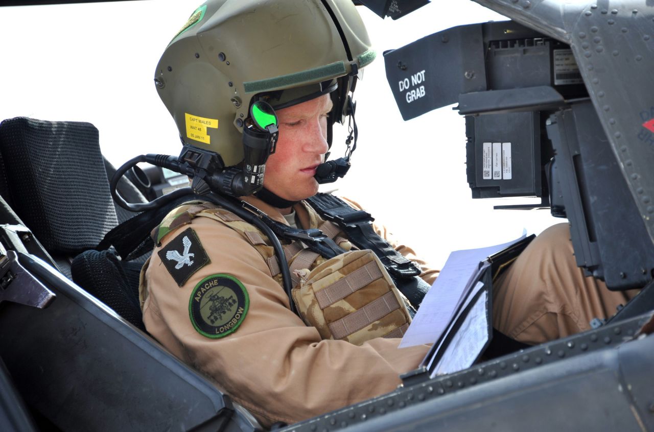 October 2011: Prince Harry prepares his Apache helicopter to go out on a mission in El Centro, California. 