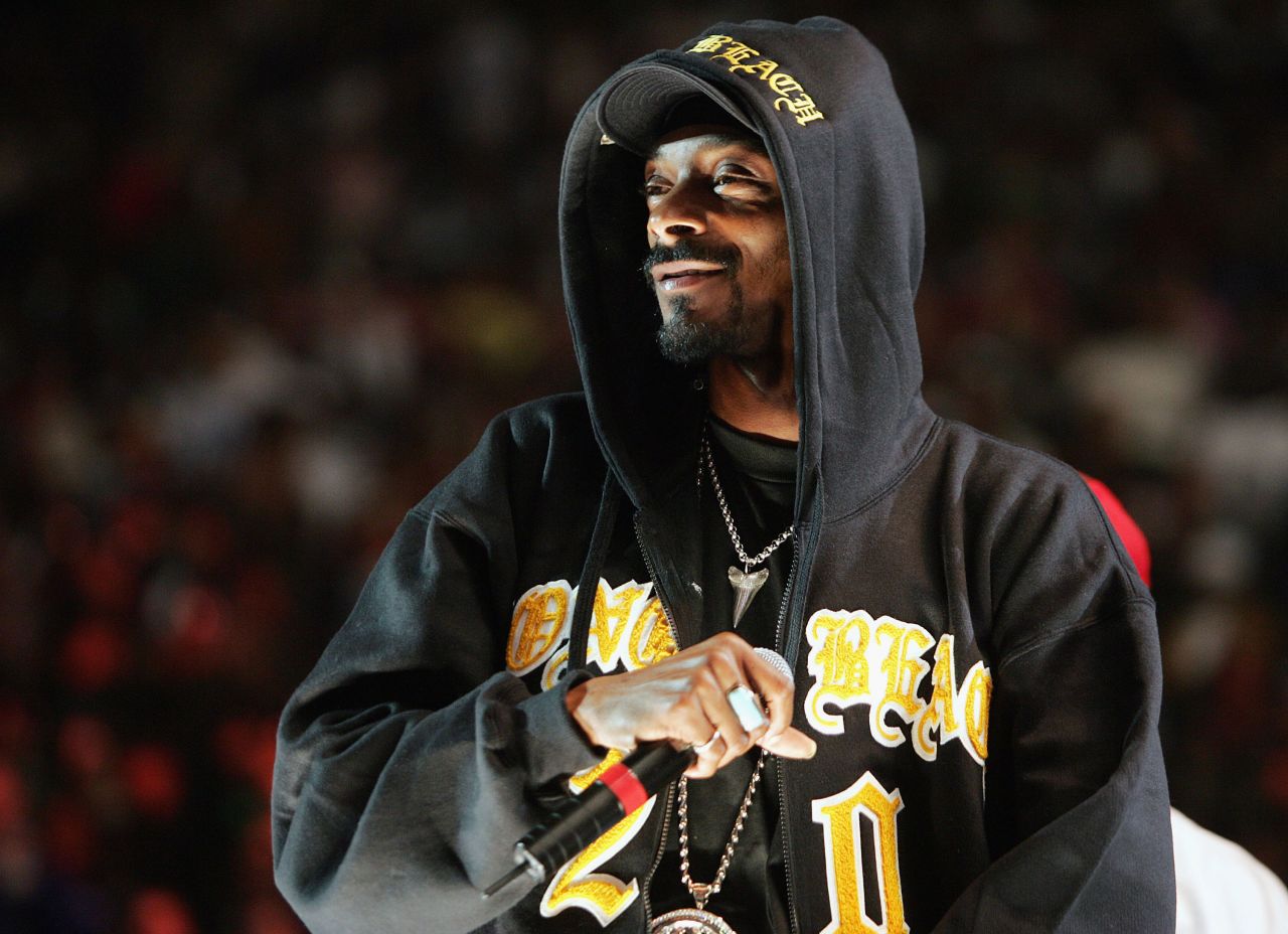 Snoop Dogg performs in a hoodie at New York's Madison Square Garden in November 2004.