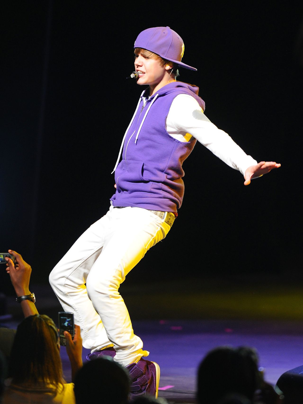 Justin Bieber wears a hoodie during a 2010 performance in Atlanta.