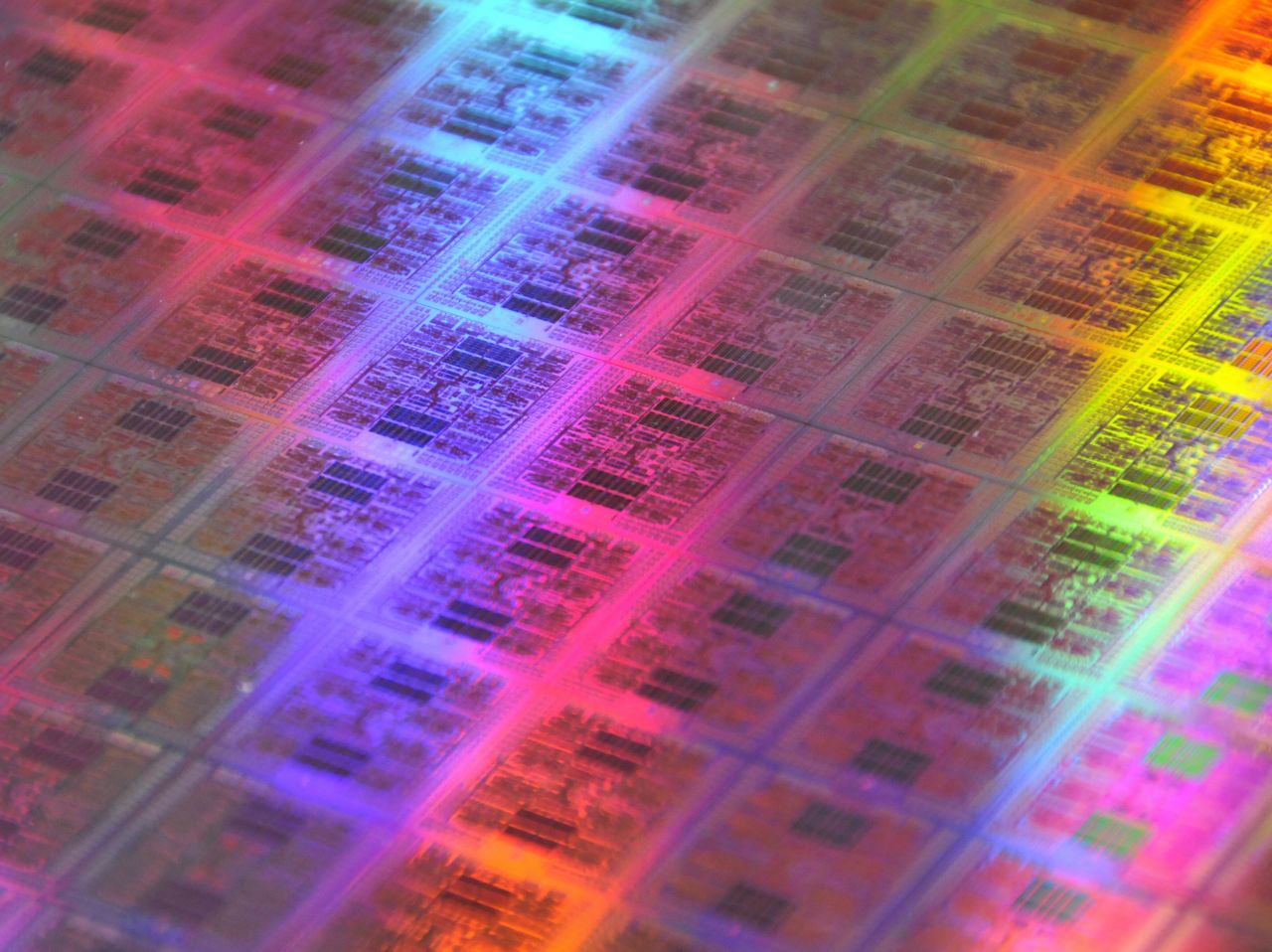 A wafer of traditional computer chips containing transistors.