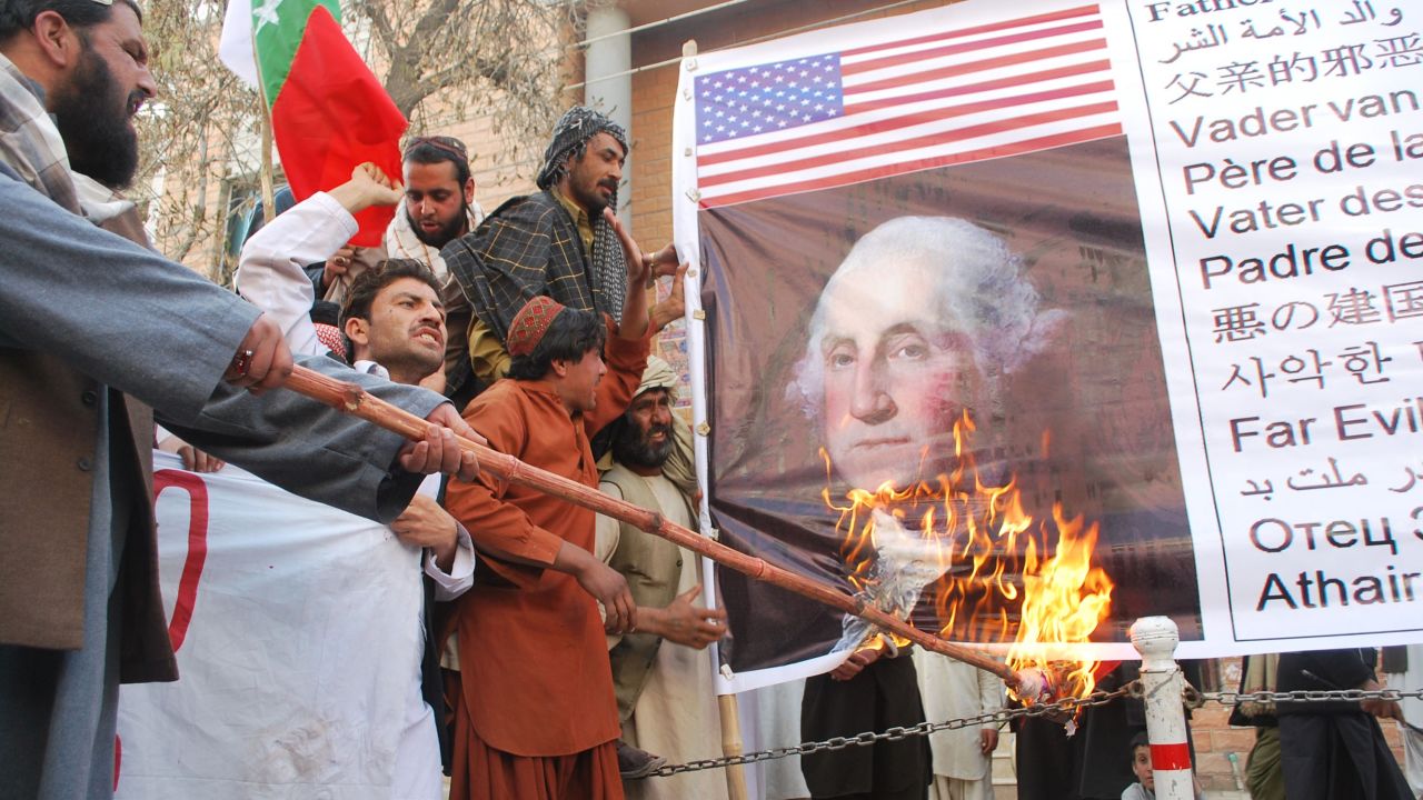 Activists of Awami Majlis Amal burn a picture of first U.S. president George Washington during a protest in Quetta, Pakistan, on March 16.