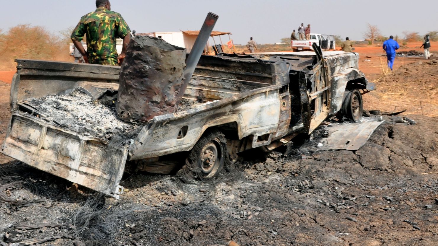 A burnt military vehicle sits where South Sudanese troops and Sudan government forces clashed along the border near Hegleg, the central area for Sudan's oil production.