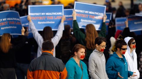 Protesters on both sides of the health care debate demonstrate outside the U.S. Supreme Court last week.