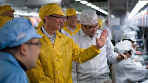 Tim Cook tours a Foxconn plant in Zhengzhou, China, on March 28. The plant's 120,000 workers assemble Apple products.