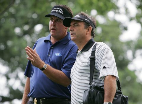 Haney defended himself from criticism by Phil Mickelson's former coach Rick Smith, right, who said the book violated traditional trust in such a relationship.