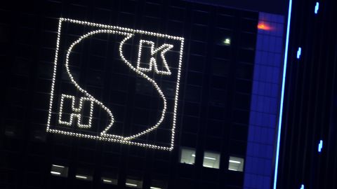 An illuminated logo of Sun Hung Kai Properties adorns the company's headquarters in Hong Kong on March 29.