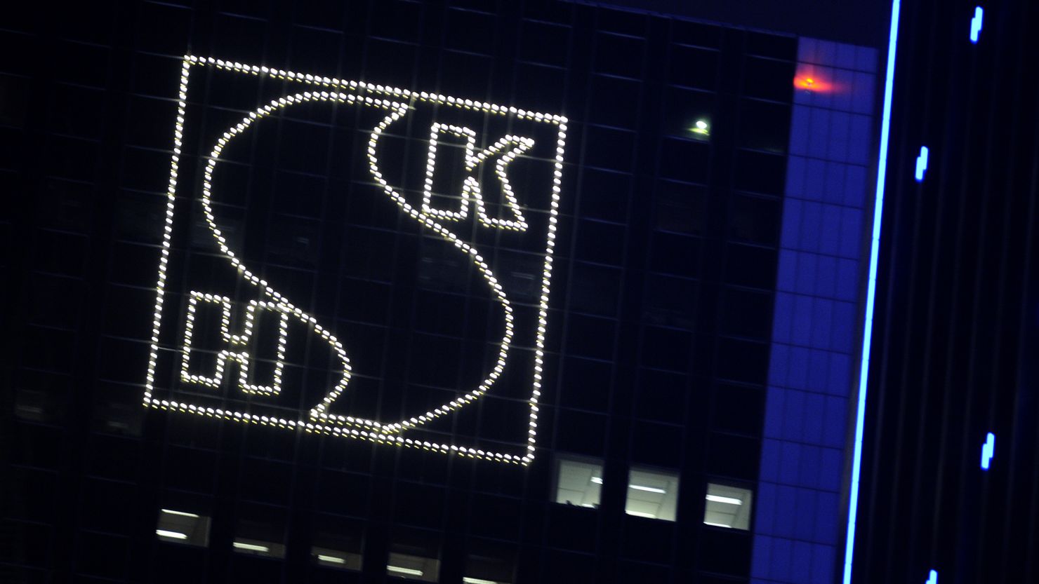 An illuminated logo of Sun Hung Kai Properties adornes the company's headquarters in Hong Kong on March 29, 2012.