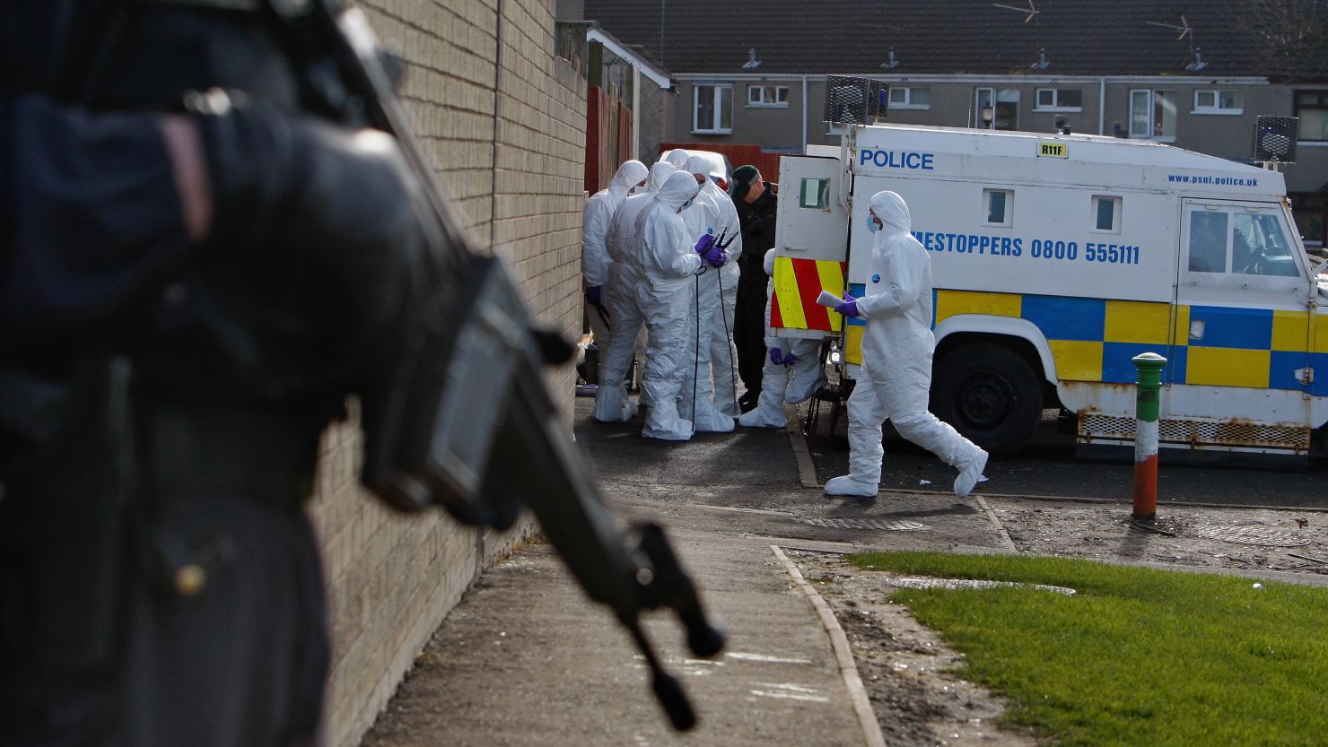 (file photo) Police search houses near to where gunmen shot Stephen Carroll on March 12, 2009 in Craigavon, Northern Ireland.