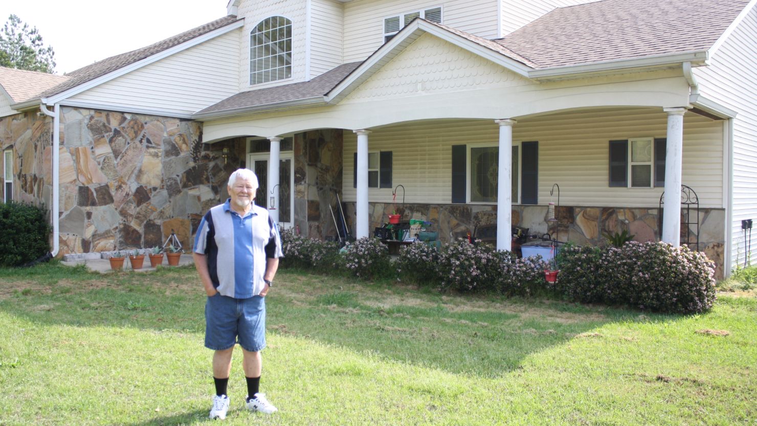 Robert Maddox of Juliette, Georgia, poses on his property. Maddox says Georgia Power expressed interest in buying his property after leveling the house next door and sealing the water well.