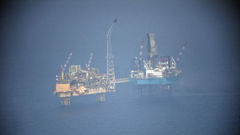 Large volumes of gas continued Friday to gush into the North Sea from an offshore oil platform.