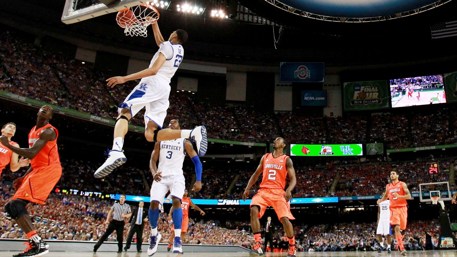Kentucky's Anthony Davis dunks on Louisville during the Wildcats' 69-61 semifinal victory Saturday night in New Orleans.