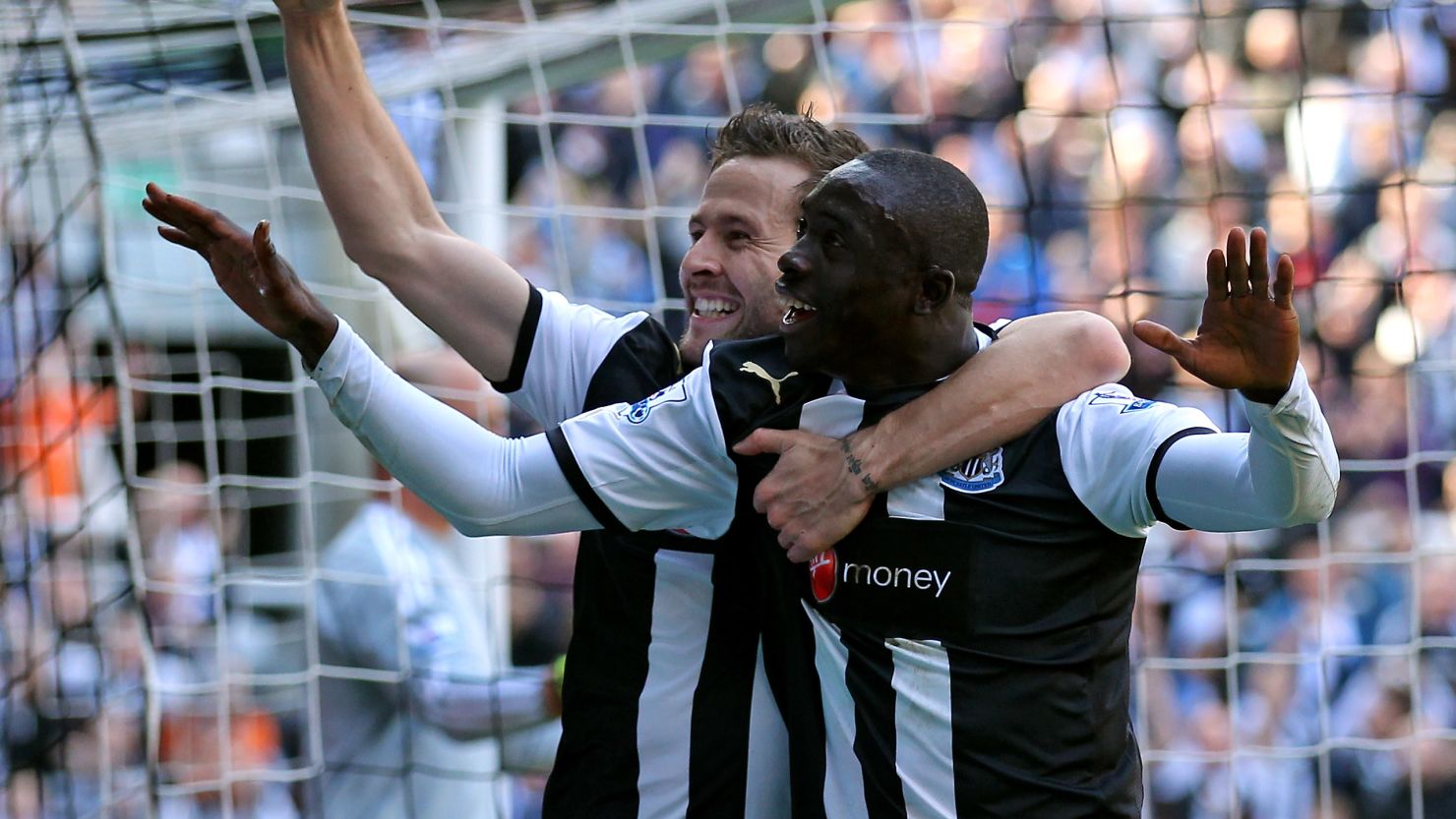Papiss Cisse celebrates scoring twice for Newcastle in their 2-0 win over 10-man Liverpool.