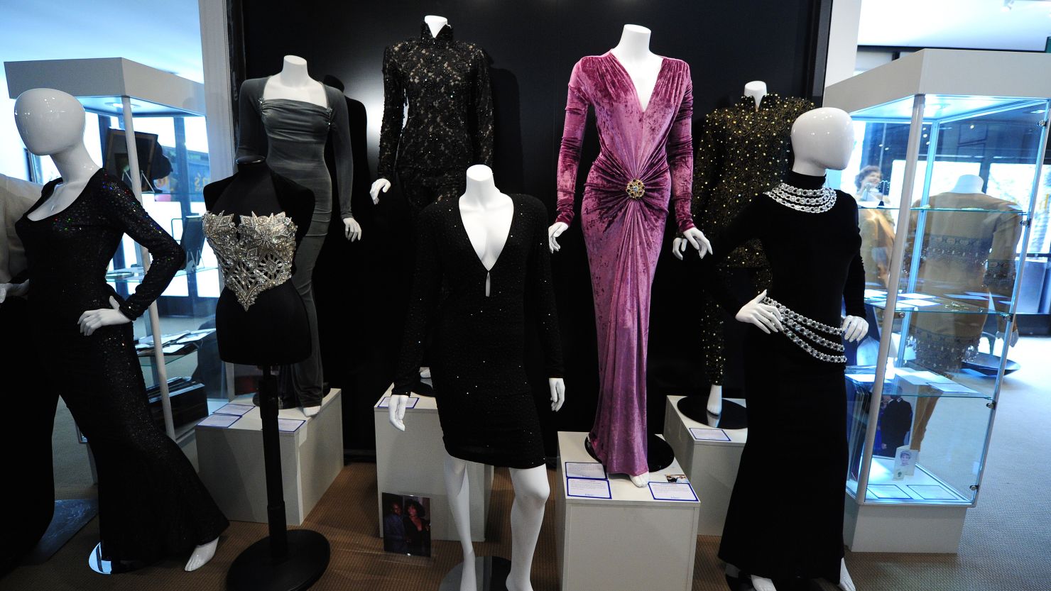 A collection of dresses worn by Whitney Houston stands on display Friday ahead of an auction in Beverly Hills, California.