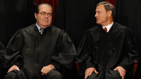 Supreme Court  Associate Justice Antonin Scalia, left, and Chief Justice John Roberts are expected to vote against the mandate.