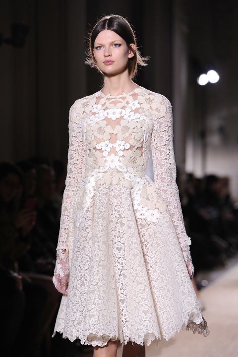 Valentino brought back white in a big way for spring. This diaphanous lace dress is one of the season's most popular trends.