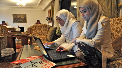 Sondos Asem, right, and her mother, Manal Abu Hassan, use social media in their Cairo living room 