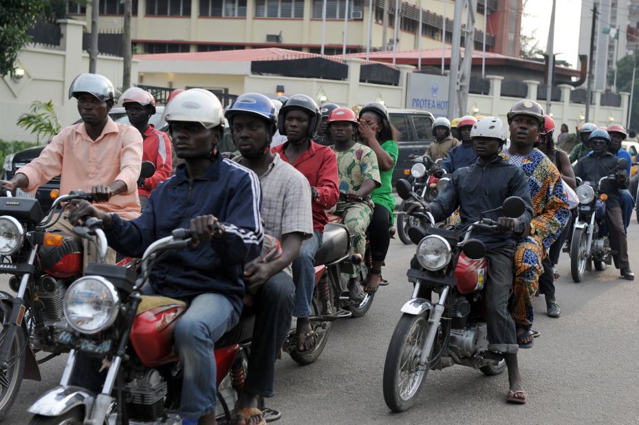 Riding a motorcycle taxi, also known as "okada," is one of the ways to get around Lagos.  