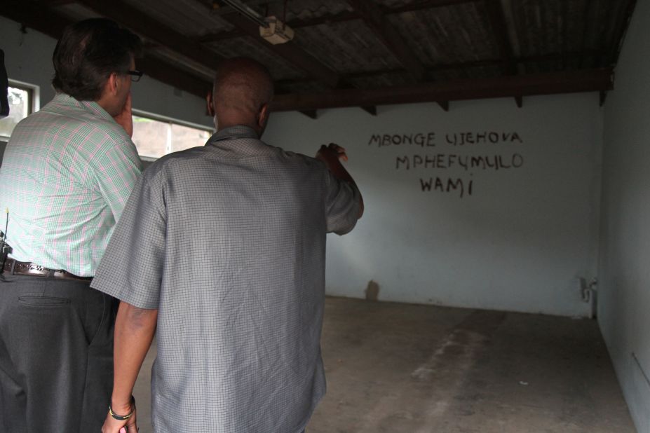 Before they began collaborating musically, Mambazo granted Hampson a tour of the small township where Shabalala was born and raised. Here, Shabalala points to the back wall of his old garage where the band would rehearse, and on which are inscribed the words: "My soul gives thanks to the Lord."      
