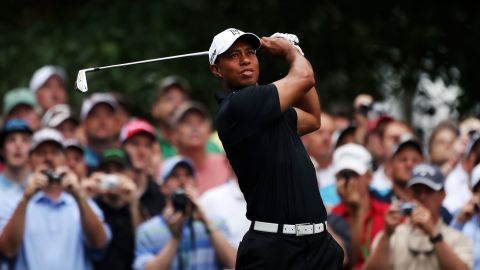 Tiger Woods hits a shot during a practice round Tuesday as he prepares for the 2012 Masters Tournament.