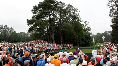 It was only a practice round, but a crowd gathered to watch Woods.