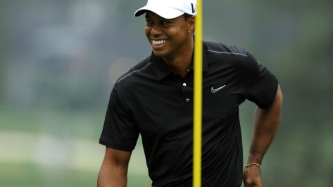 Tiger Woods smiles during Tuesday's practice round.