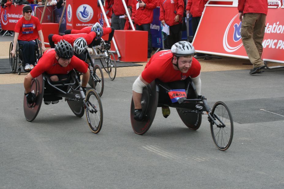 Wheelchair racers were among the competitors following a route which took them past many of the Olympic venues, including the velodrome and the aquatics center.