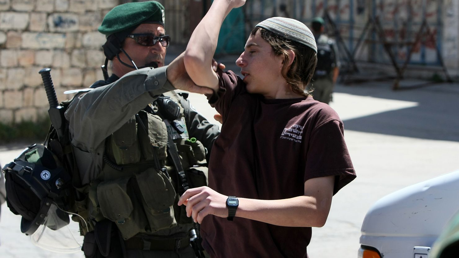 A Jewish settler argues with an officer as Israeli forces evict settlers from a house in Hebron, West Bank, on Wednesday.