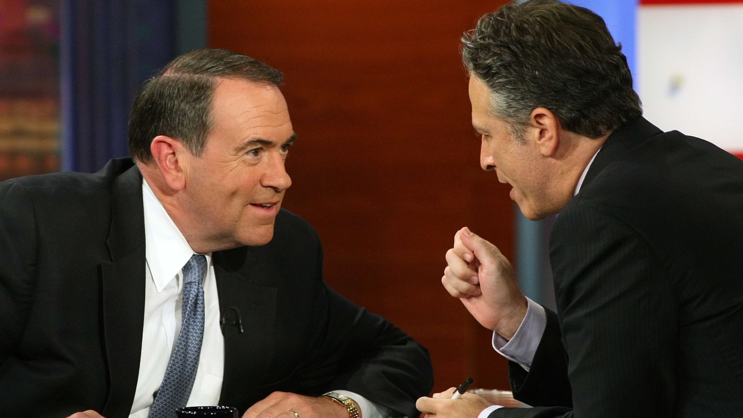 Jon Stewart, right,  interviews Mike Huckabee on the 'The Daily Show" in September, 2008. Huckabee is now with Fox News.