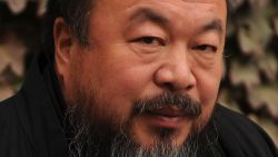 (FILES) This file picture taken on November 7, 2010 shows Chinese artist Ai Weiwei in the courtyard of his home in Beijing where he was under house arrest. Chinese artist and activist Ai Weiwei is reuniting with the Swiss architects with whom he created Beijing's spectacular Bird's Nest Stadium, to build a pavilion for this year's London Olympics. Ai, along with the Swiss firm Herzog and de Meuron, will join forces again to design a pavilion for the Serpentine Gallery in London's Kensington Gardens park, the gallery said on February 7, 2012. AFP PHOTO / FILES / Peter PARKS (Photo credit should read PETER PARKS/AFP/Getty Images)