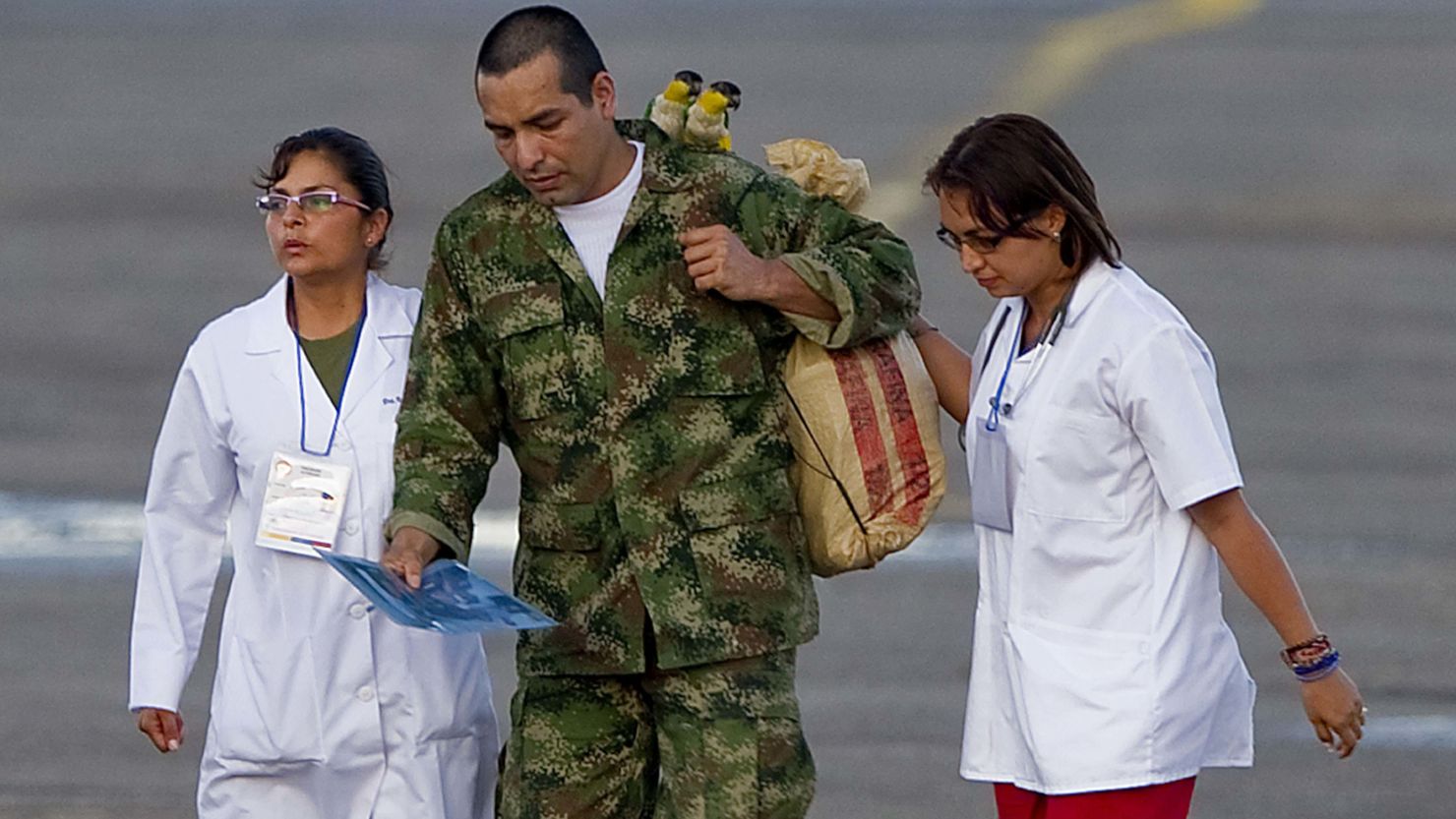 Former FARC hostage Robinson Salcedo Guarin has two birds on his shoulders upon arriving in Villavicencio, Colombia, Monday.