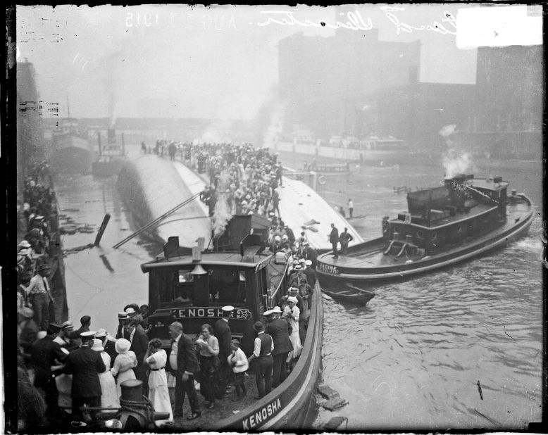 The tugboat Kenosha rescues survivors from the hull of the overturned Eastland steamer in Chicago, Illinois, on July 24, 1915. About 840 people died.