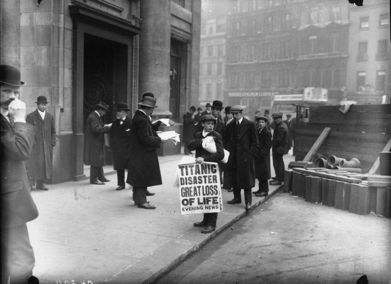 Newspaper boy Ned Parfett sells copies of the Evening News on April 16, 1912 outside the White Star Line offices in London.