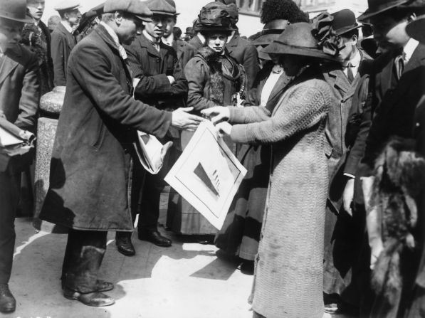 <strong>International fascination: </strong>A woman buys a souvenir print of the Titanic shortly after the disaster. More than a century later, the shipwreck still captivates people.