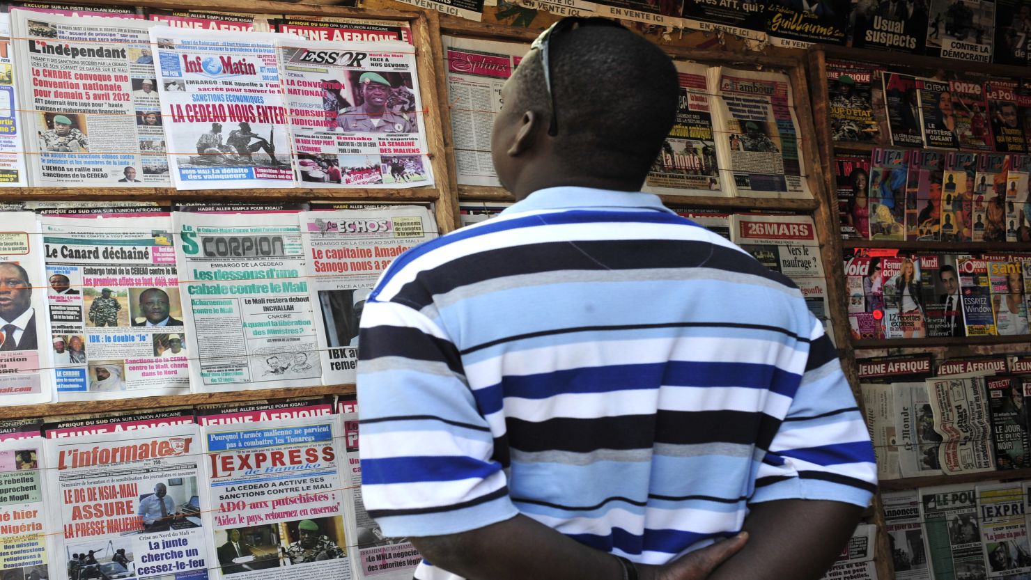 A man reads a local newspaper on Wednesday in Bamako, commenting on the situation in the north.