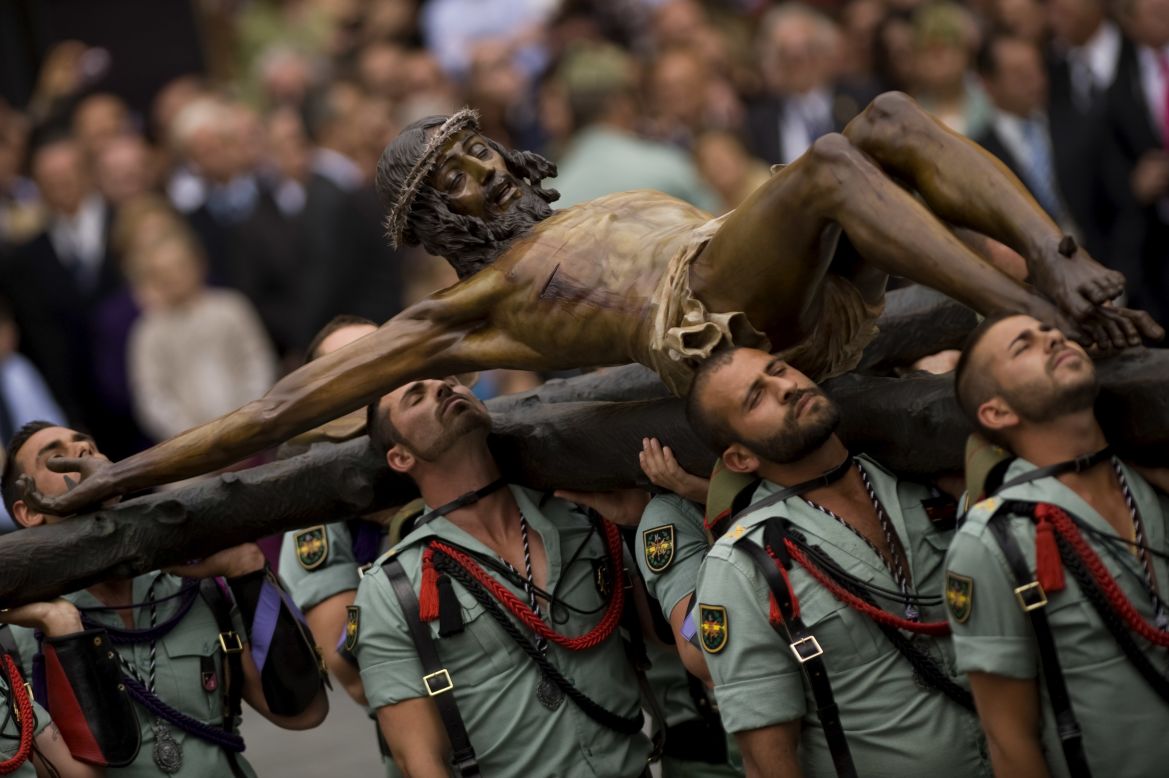 Members of the Spanish Legion carry a statue of "Christ of the Good Death" to Santo Domingo de Guzman Church in Malaga, Spain, during a Holy Week procession.