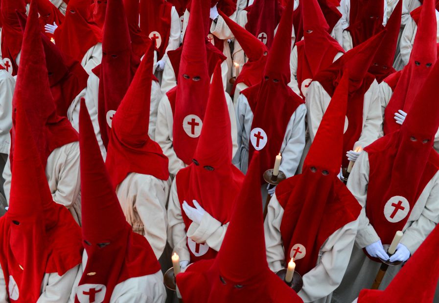 Penitents of the Cofradia del Silencio (Brotherhood of Silence) wait for the start of their Holy Week procession shortly before it was canceled because of rain in Zamora, Spain. Easter week is traditionally celebrated with processions in most Spanish towns.
