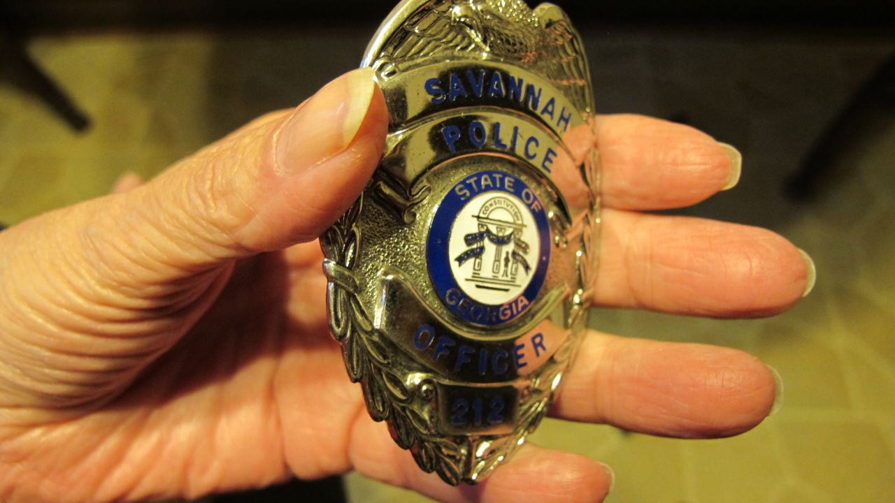 Anneliese MacPhail carries her son's police badge with her always, tucked in her handbag. 