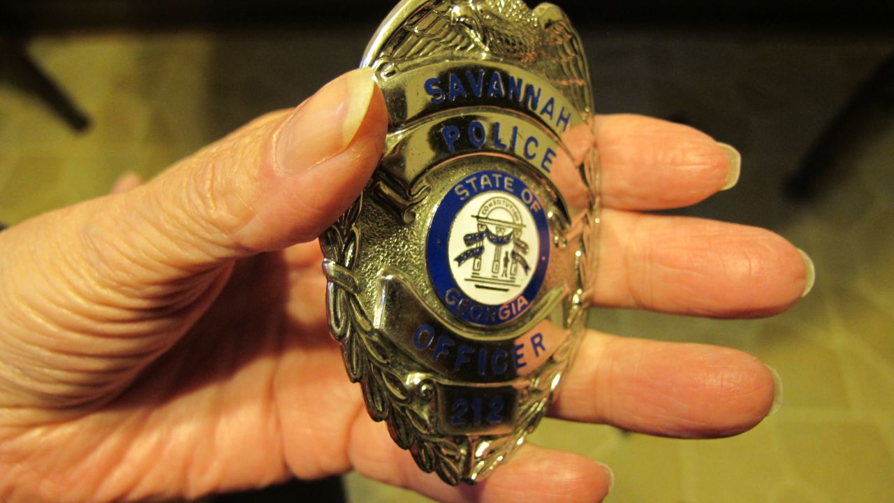 Anneliese MacPhail carries her son's police badge with her always, tucked in her handbag.